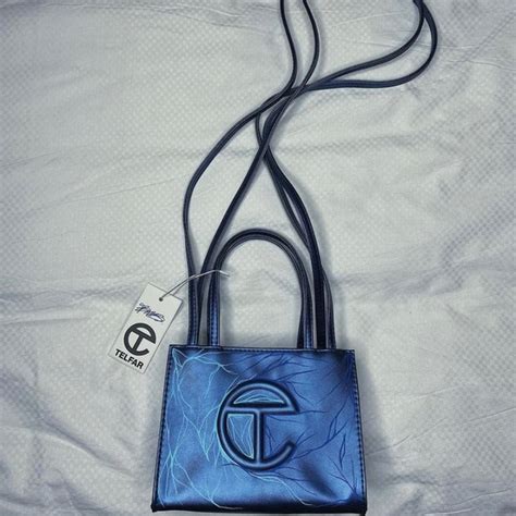 dark blue telfar bag.